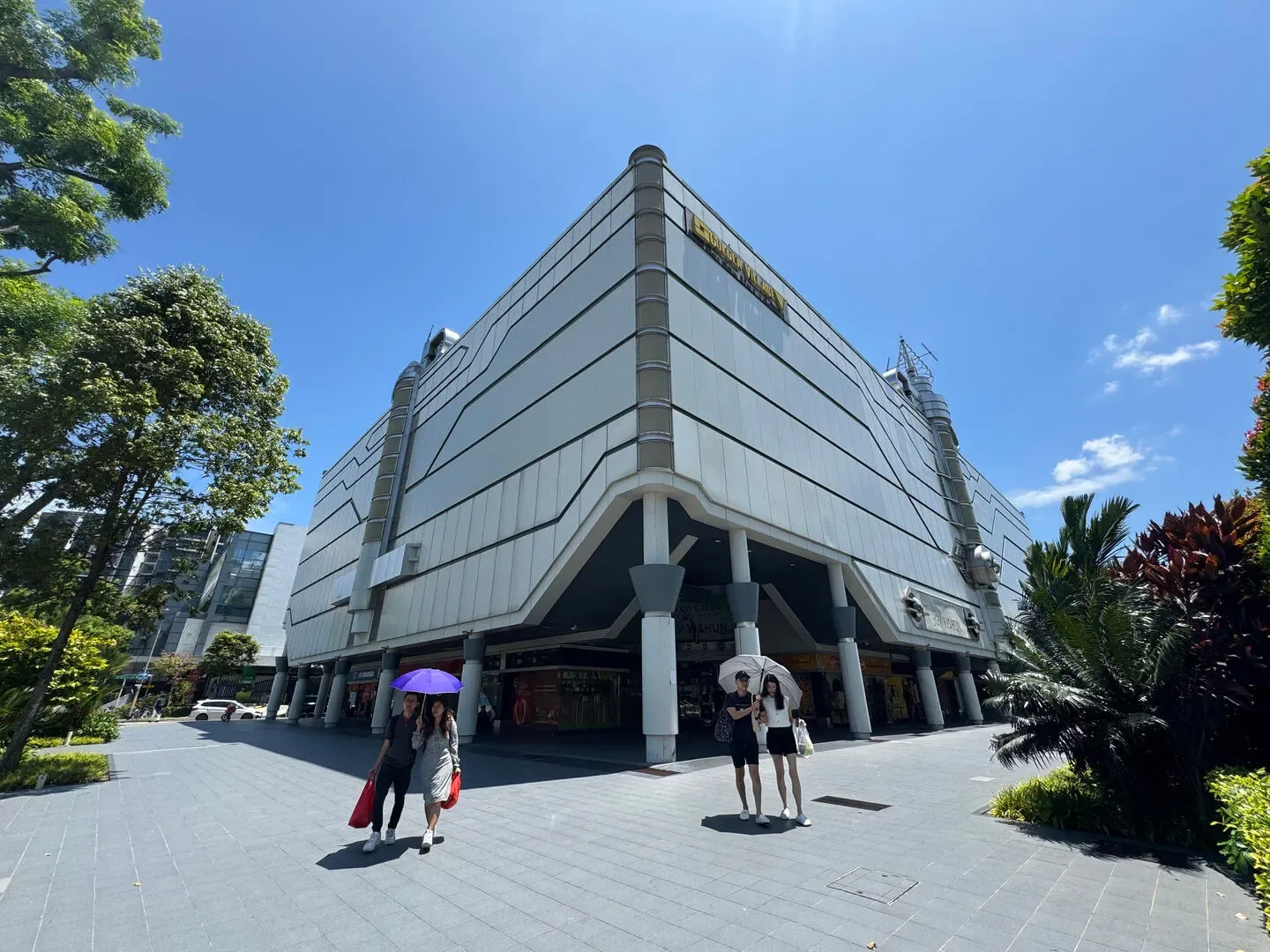 Corner of the Yishun 10 building at 51 Yishun Central 1, with its covered walkway and shops